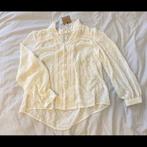 Ivory/cream blouse.